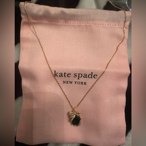 Kate spade 
PAVE EMERALD PRESENT PENDANT sold out